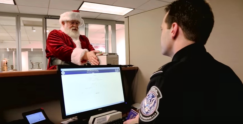 Santa Claus gets his biometric scan for entry into the United States (US Customs and Border Protection screenshot via YouTube)